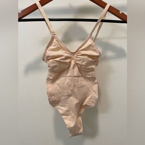 SKIMS shapewear tags off but never worn! Targeted compression for shaping. S-M.